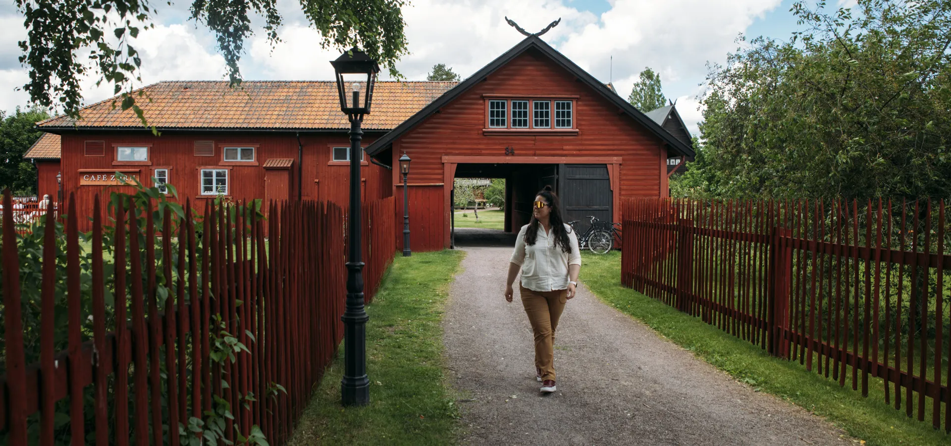 A woman walking on a road.