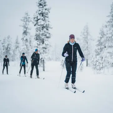 A couple friends doing some cross country skiing.