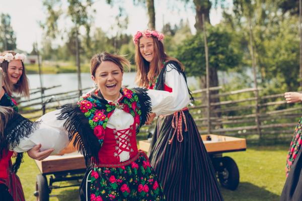 Girls in folk costumes during a midsummer celebration.