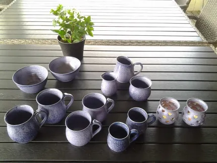 Ceramic mugs on a table.