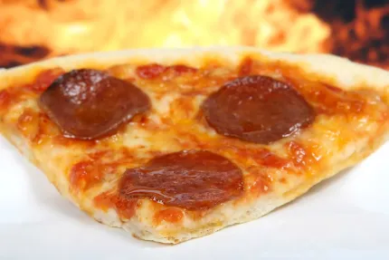A slice of a pepperoni pizza
