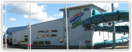 A person standing in front of a building.